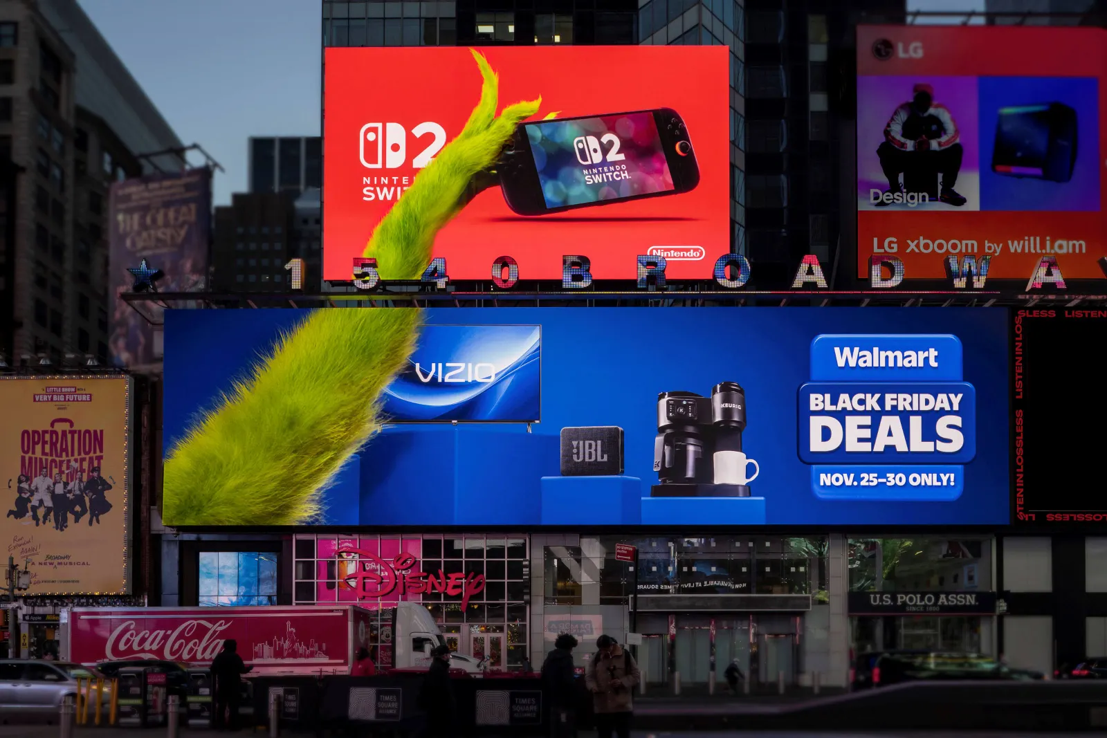 Times Square billboards for Walmart show the Grinch&#x27;s arm showcasing products like a Nintendo Switch 2